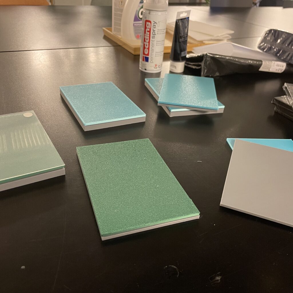 Physical product mockups laid out on a table during a Gnist product testing workshop.