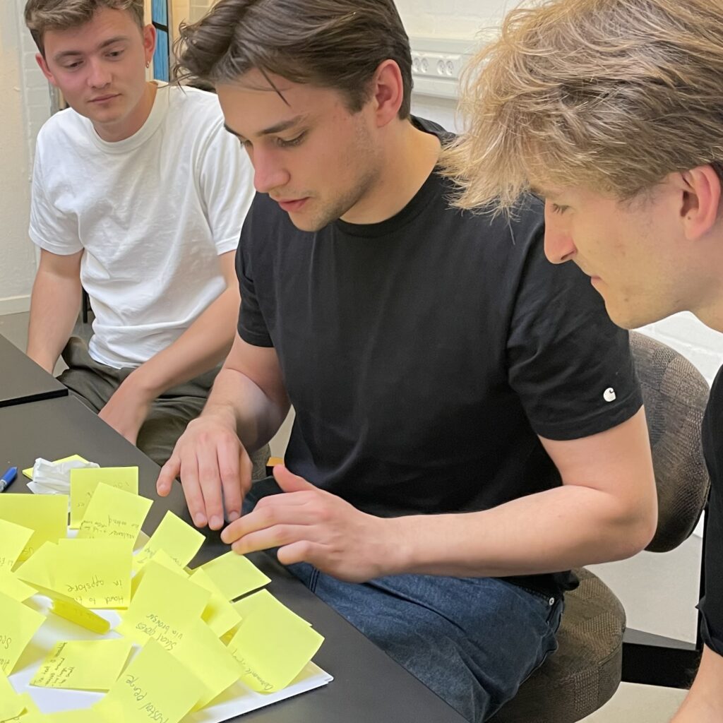 Team collaborating with post-it notes during a Gnist ideation sprint workshop